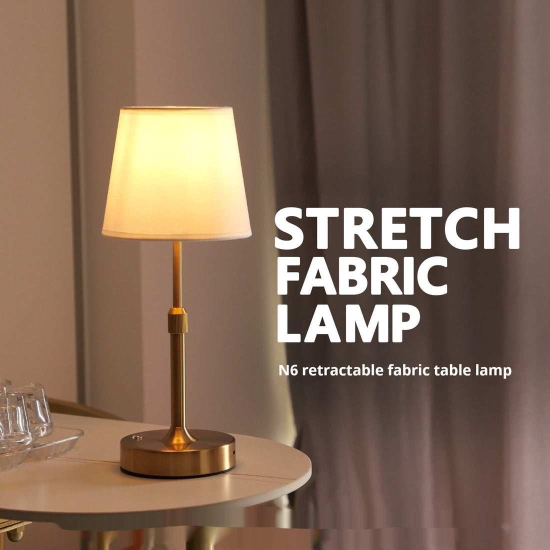 Retractable fabric table lamp in a metallic finish from LumaNest