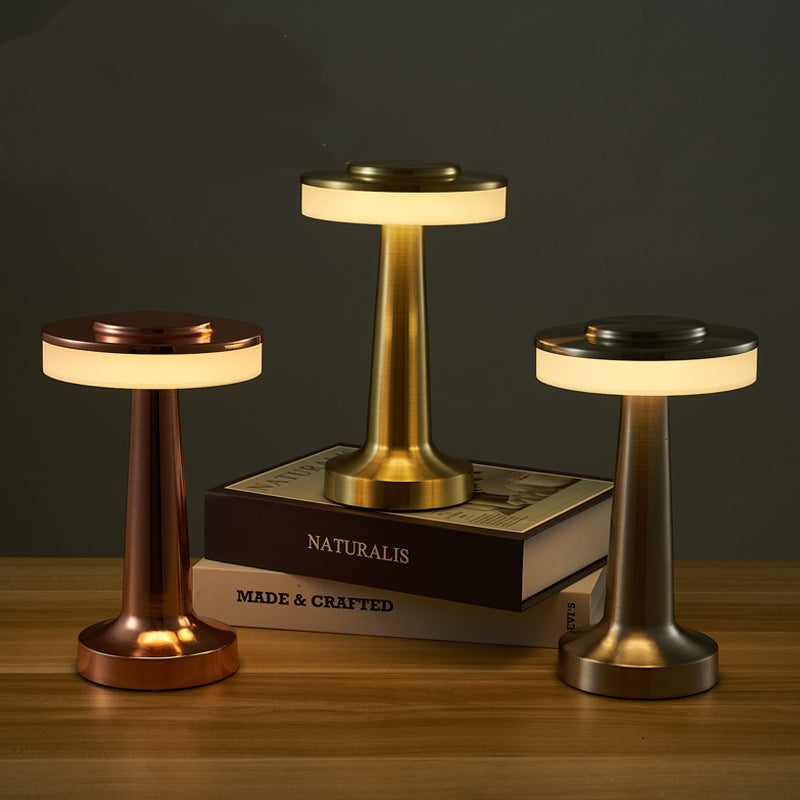 Gold cordless restaurant table lamp from LumaNest shown on a neutral background